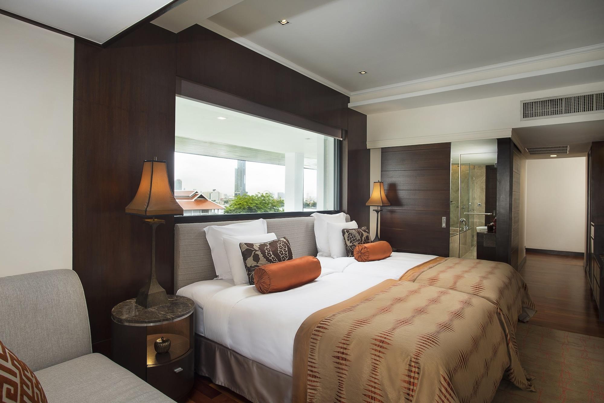 Anantara Riverside Bangkok Resort Exterior foto A bedroom at the Taj Mahal Palace