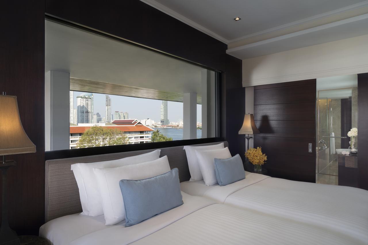 Anantara Riverside Bangkok Resort Exterior foto A bedroom at the hotel